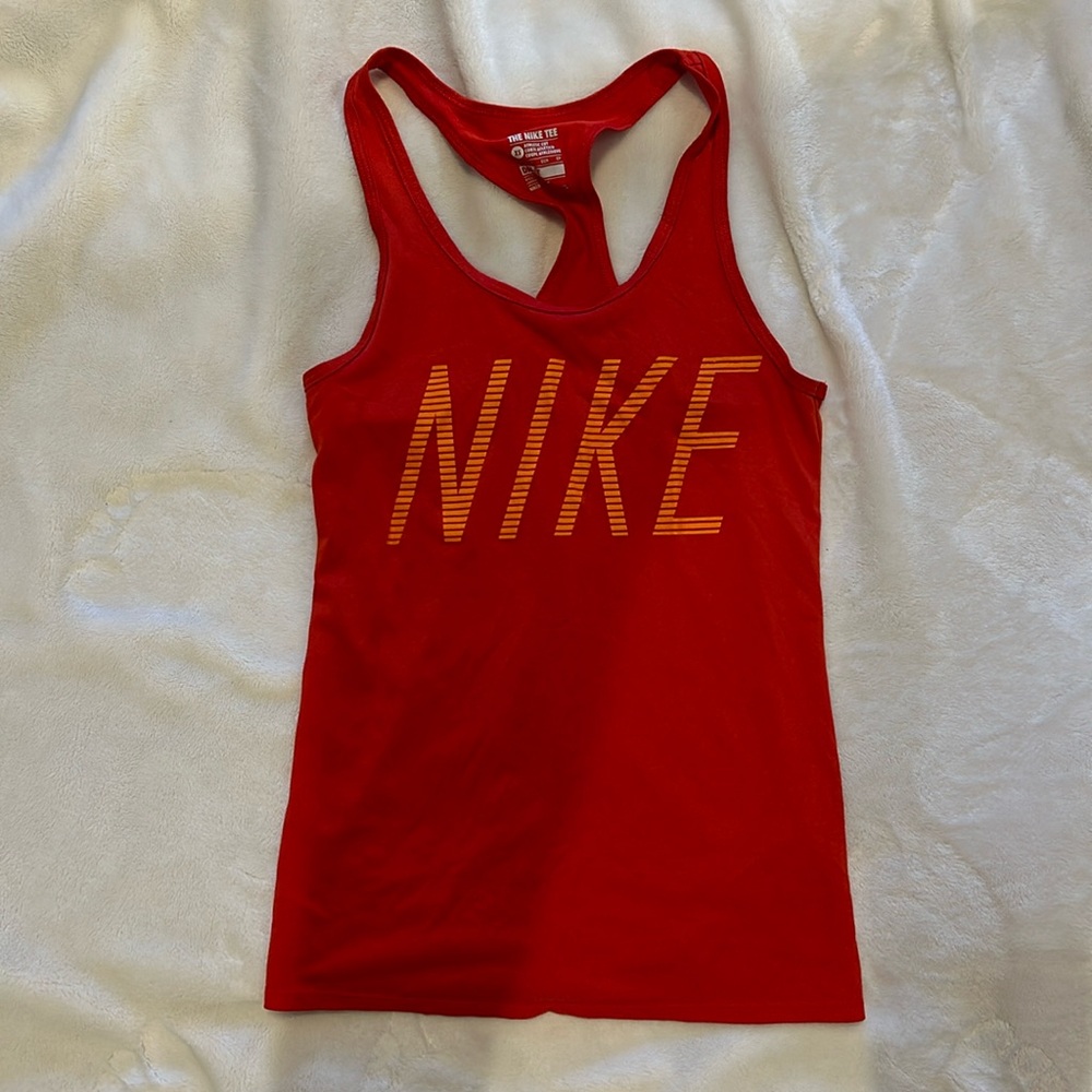 Red “the Nike tee, dri-fit” with orange lettering XS